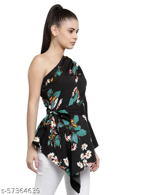 Black floral one-shoulder crepe top on hanger, printed net pattern, long sleeves, polyester fabric