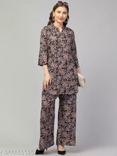 Black multi-printed rayon top with palazzo set, featuring three-quarter sleeves and printed design on woman's dress fabric, machine washable, suitable for various occasions, India origin