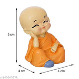 Multicolor polyresin Little Baby Monk Buddha set for car dashboards or home decor, features 4 pieces of intricate detailing. Ideal as a gift or display on shelves
