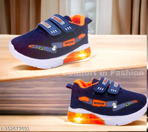 Blue and orange synthetic slip-on shoes with solid design, featuring rubber sole and velcro fastening. Bachoo light wale joote on display