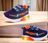 Blue and orange synthetic slip-on shoes with solid design, featuring rubber sole and velcro fastening. Bachoo light wale joote on display