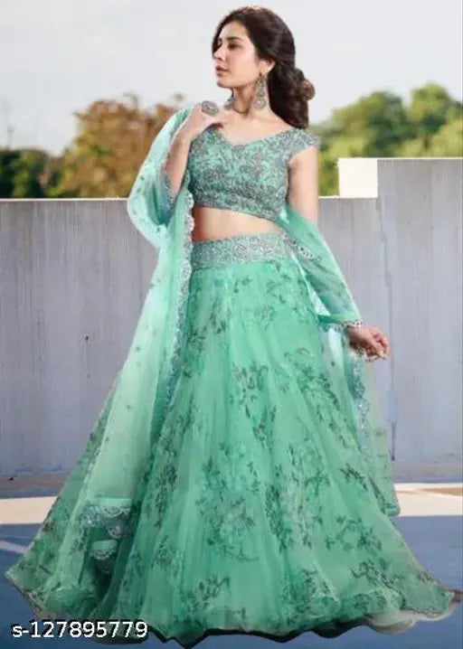 Green semi-stitched net lehenga choli with floral embroidery and matching net dupatta, ideal for traditional Indian events