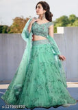 Green semi-stitched net lehenga choli with floral embroidery and matching net dupatta, ideal for traditional Indian events