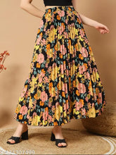 Black floral pleated maxi skirt with pockets, elegant long design for women, perfect for any occasion. High-quality crepe fabric from India