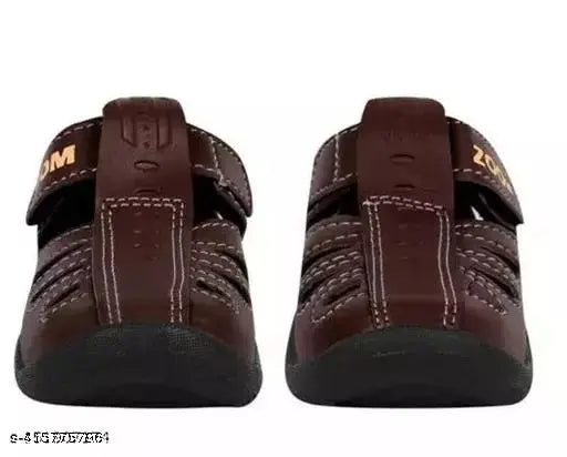 Brown leather and rubber Delta velcro casual sandals for unisex kids, offering comfort and durability with a soft fit and enhanced lightweight feel