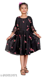 Black Georgette embroidered fit and flared dress, featuring short sleeves and a length of 29-32 inches. Dress can be fitted for bust sizes 26-34 inches and waist sizes 20-28 inches. Made in India with attached inner lining. Dry clean or hand wash