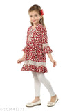 Printed polyester kurta set with lace and pom-pom detailing, three-quarter sleeves, and zipper back. Available in sizes from 5-12 years old. Handcrafted Indian clothing for kids
