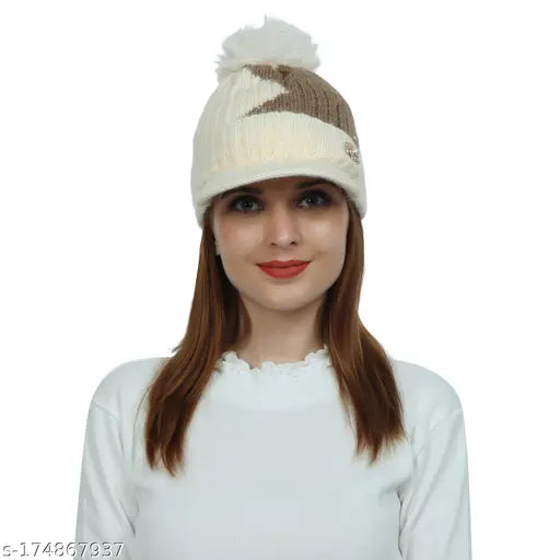 Woolen colorblocked beanie, soft & warm with fur-lined pompoms. Ideal for winter, suitable for women and girls. Made in India." (123 characters)