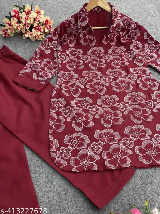 Attractive cotton kurta set with trending embroidery work, three-quarter sleeves. Traditional Indian women's wear. Includes 1 kurta and 1 pant." (103 characters)