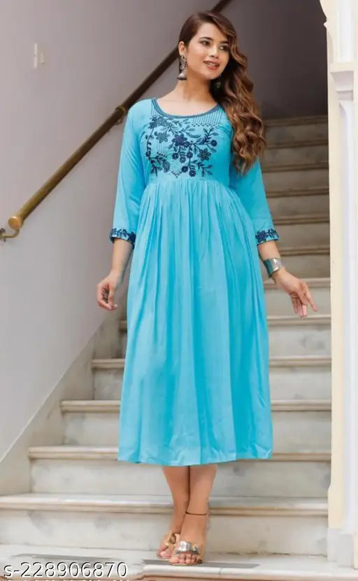 Rayon, embroidered 3/4 sleeve blouse with mint color, India-made women's fashion on mannequin