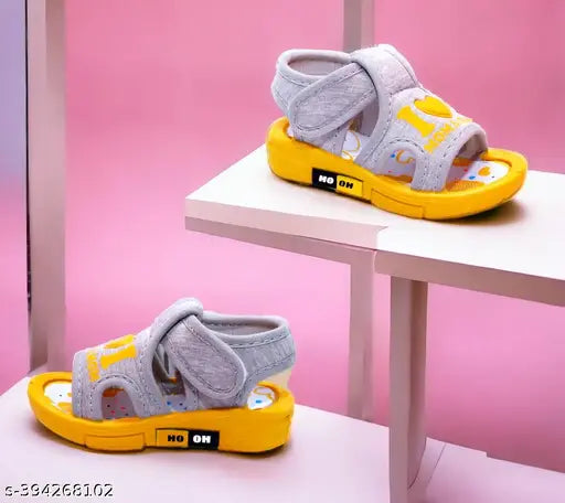 Yellow waterproof durable canvas sandals for kids, cute design with printed net and whistle feature