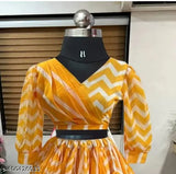 Fancy yellow chiffon Lehengha choli and skirt set, featuring detailed organza floral designs, ideal for special occasions, elasticated waist and hemlines for comfort, Indian origin