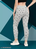 Women's printed cotton blend jegging combo pack (2 pieces), featuring vibrant patterns. Available in sizes 26-Free (waist: 26in-34in, length: 35in). Indian-made fashion jeggings set on display