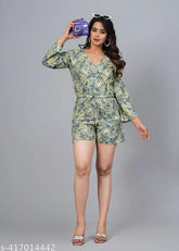 Green rayon short jumpsuit with three-quarter sleeves and printed net pattern. Women's fashion accessory, best quality fabric, India origin