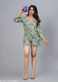 Green rayon short jumpsuit with three-quarter sleeves and printed net pattern. Women's fashion accessory, best quality fabric, India origin