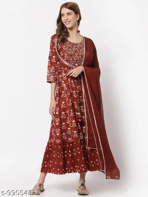 Yellow Cloud printed and embroidered flared cotton gown with chiffon dupatta (rust), featuring hand dori work, gota embellishments, and round neck with three-quarter sleeves. Indian ethnic wear tailored from cotton