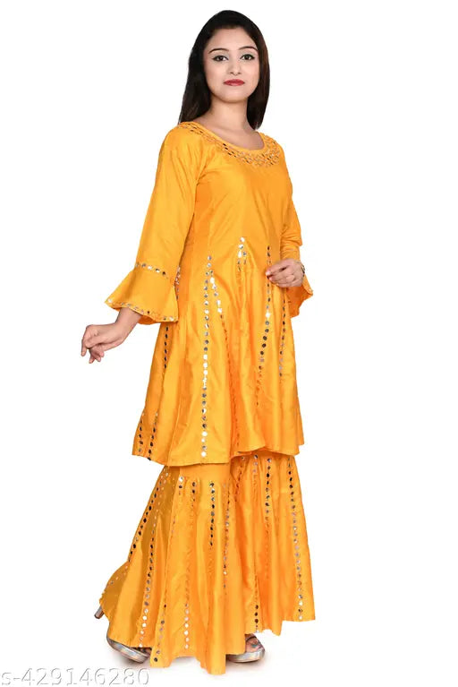 Vibrant yellow embroidered anarkali kurti set with sharara, mustard and traditional ethnic design for women. Rayon fabric, three-quarter sleeves, knee length. Perfect for festive occasions, elevating your Indian fashion wardrobe