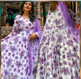 Printed silk designer gown with net dupata, long sleeves, vibrant Indian fabric on display