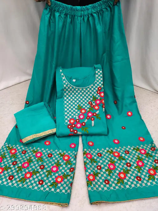 Green embroidered rayon kurta set with A-line palazzos and dupatta - traditional Indian ethnic wear featuring floral embroidery, three-quarter sleeves, and coordinating green shades. Comfortable daily wear suitable for versatile casual outings. Made in India