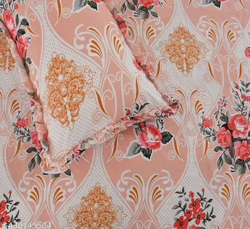 Luxmi cotton king-size bedsheet set, two decorative frill pillow covers, and two heart-shaped cushion covers. Multicolor botanical design on soft, high-quality cotton for summer bed décor