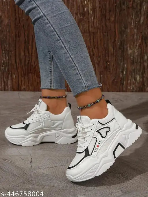 Textured canvas and PVC sneakers, lace-up design, available in sizes 3 to 8 (US sizes 21-24.5 inches). Made in India