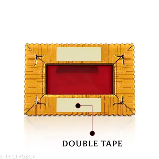 Gold-plated hand-painted Ganesha idol for car dashboard or home decor, intricately detailed with focused craftsmanship, Indian origin