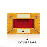 Gold-plated hand-painted Ganesha idol for car dashboard or home decor, intricately detailed with focused craftsmanship, Indian origin