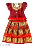 Maroon and golden yellow paisley silk lehenga choli with Pattu Langa jacket for girls, embellished with Zardozi stitch and designer silk finishes. Ideal for weddings, ceremonies, parties, birthdays, and festivals. Hand wash or dry clean recommended