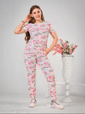 Pink printed cotton-blend night suit set for women, featuring top with short sleeves and ankle-length bottoms with pockets and drawstring waist, versatile for sleep, lounge, travel, yoga, or parties. Made in India