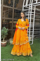 Georgette Bhandani Print Yellow Sharara Set: Indian-made yellow sharara suit with matching dupatta and bottoms, featuring long sleeves and Lucknowi Chikankari work. Single set available