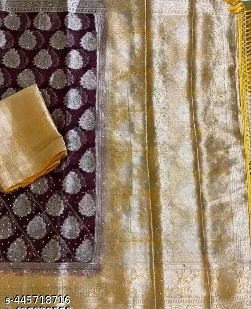 Gold-toned organza fancy saree with unique design, solid net blouse, India-made