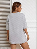 Oversized round neck cotton blend t-shirt for women in solid calming hue, three-quarter sleeves