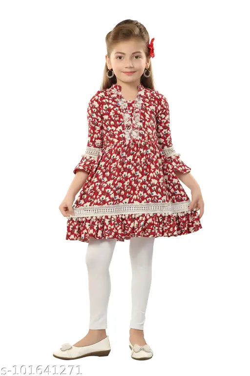 Printed polyester kurti set with churidar bottom, lace and pom-pom details, cotton lycra leggings, straight top shape, three-quarter sleeves. Kids' sizes available: 5-6yrs (23in/24in), 6-7yrs (25in/26in), 7-8yrs (27in/28in), 8-9yrs (29in/30in), 9-10yrs (31in/32in), 10-11yrs (33in/34in), 11-12yrs (35in/36in), 12-13yrs (37in/38in), 13-14yrs (39in/40in). Indian origin