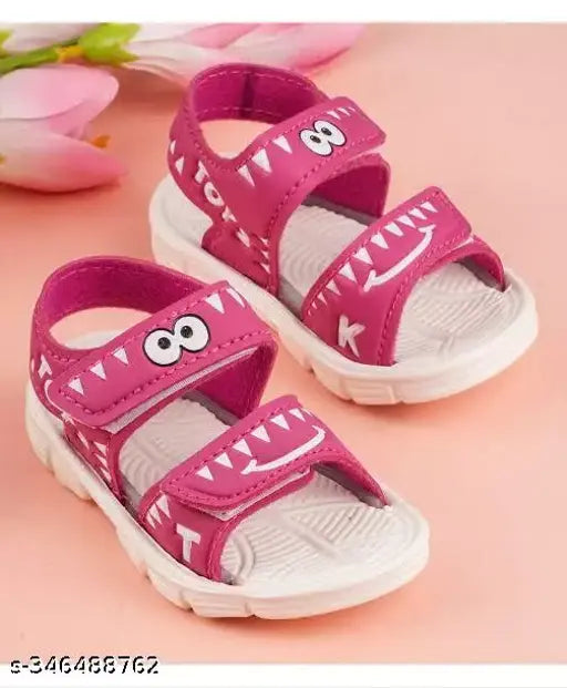 Pink cotton sandal with TPR sole, featuring Angry Birds pattern and buckle fastening. Ideal for boys aged 9-12 months. High-quality children's shoe from India