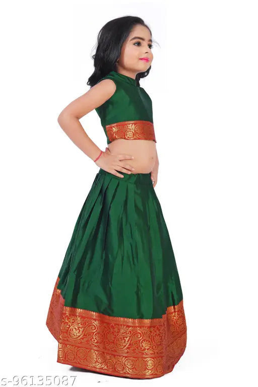 Girls cotton silk pattu Pavadai Lehenga Choli set in solid colors, acrylic dupatta and sleeveless top on display stand, suitable for Indian festivals or traditional events