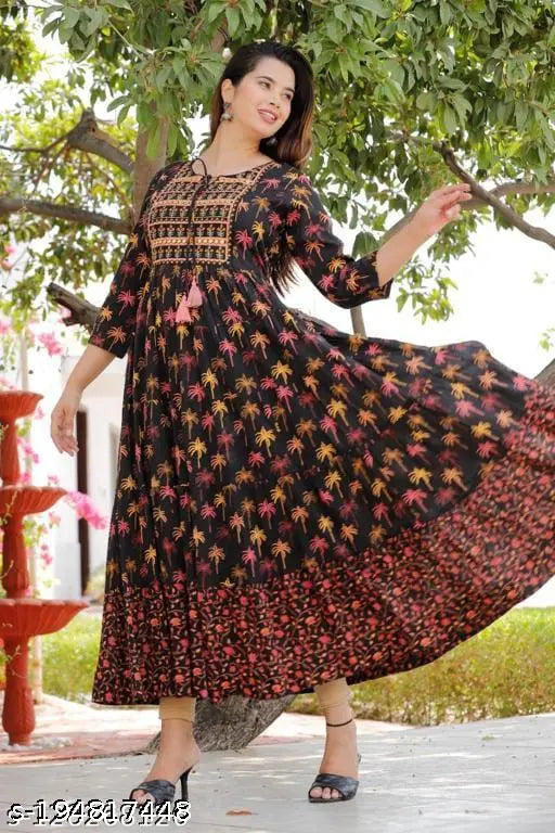Vibrant multi-color Rayon long-tiered kurti with embroidered yoke and tassels, three-quarter sleeves, printed pattern. Available in various sizes (S-XXXXL). Indian origin