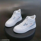 Synthetic leather, colorblock college casual sneakers for girls. Solid pattern lace-up skate shoes on display