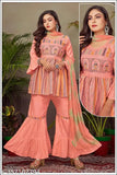 Pink rayon embroidered kurti set with sharara and dupatta, featuring three-quarter sleeves. Affordable women's partywear, perfect for any occasion. Made in India