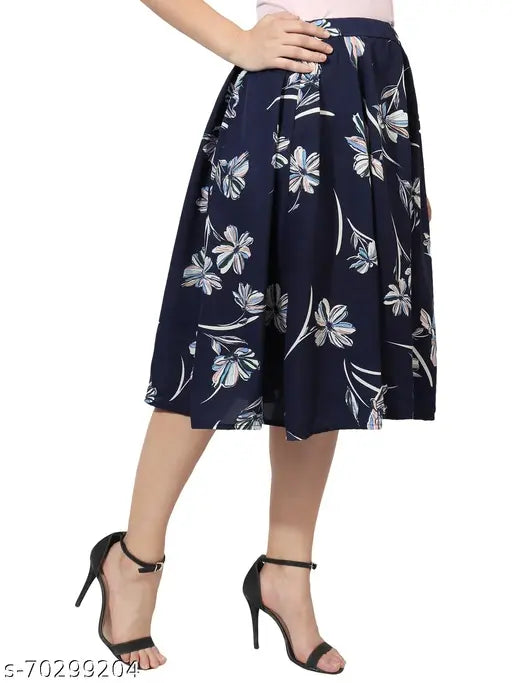 White floral blue heart print mid-calf length women's IBPanel polyester skirt combo, flared style with crepe pattern and printed net detail. Available in sizes 26, 28, 30, 32, 34. Made in India
