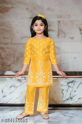 Vibrant printed rayon kurta palazzo set for kids, exuding charm and grace. Sizes: 4-5yrs(24in/26in), 5-6yrs(25in/27in), 6-7yrs(26in/28in), 7-8yrs(27in/29in), 8-9yrs(28in/30in). Made in India