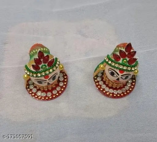 Wooden Riddhi Siddhi Ganesh Idols (Set of 2), decorated with artificial pearls, diamonds, and good fabrics. Ideal for home temple worship or spiritual occasions. Indian craftsmanship