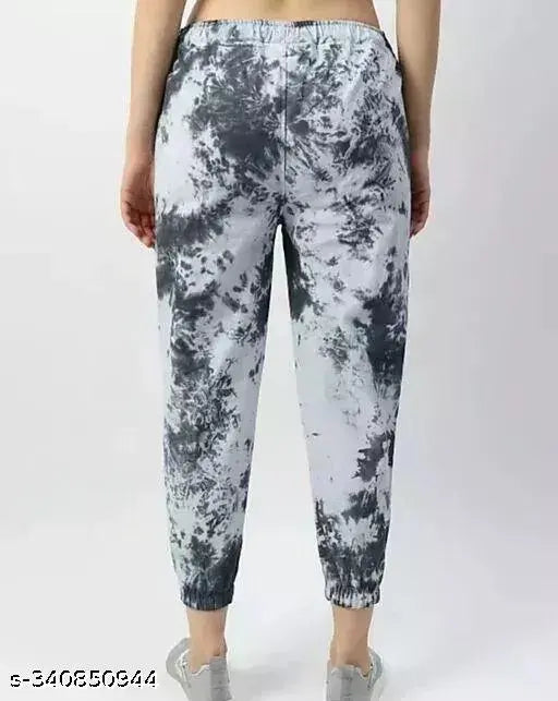 Multicolor dyed polyester women's joggers with adjustable fit, elastic cuffs, and large side pockets for gymwear, active bottomwear. Pre-washed terry fabric for comfort and breathability. Made in India