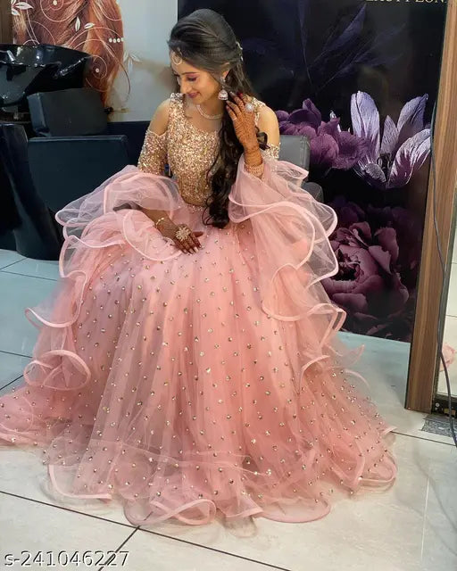 Peach velvet lehenga-choli with net bottom and lace dupatta, semi-stitched Indian bridal wear