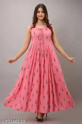 Pink cotton-blend sleeveless rayon print kurti for women, featuring a single pattern design. Model is shown wearing size M (bust: 38 in, length: 50 in). Handcrafted in India