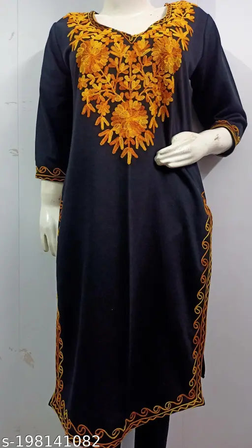 Black woolen kurti with yellow Kashmiri embroidery, three-quarter sleeves. Indo-western women's fashion wear for day, casual, or wedding occasions. Handcrafted in India