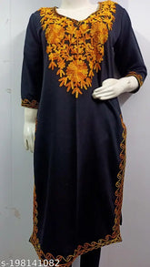Black woolen kurti with yellow Kashmiri embroidery, three-quarter sleeves. Indo-western women's fashion wear for day, casual, or wedding occasions. Handcrafted in India