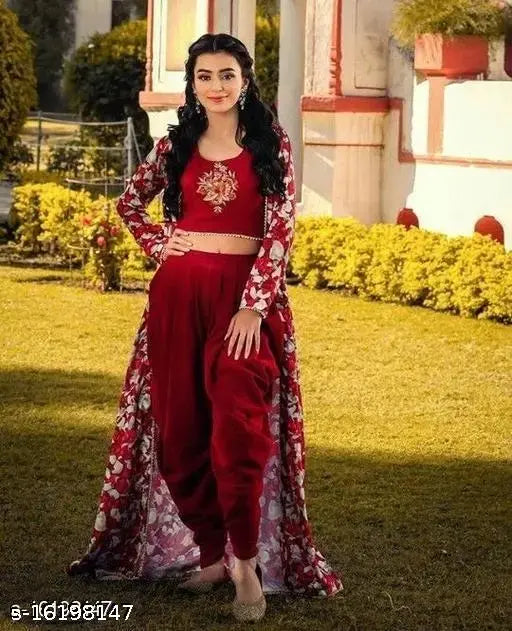 Maroon rayon dhoti set with embroidered top and shrug, traditional Indian attire on display