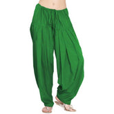 Green solid cotton Patiala for casual & party wear, regular fit clothing on hangar