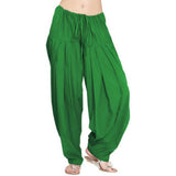Green solid cotton Patiala for casual & party wear, regular fit clothing on hangar