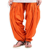 Orange solid cotton Patiala for casual & party wear, machine-washable